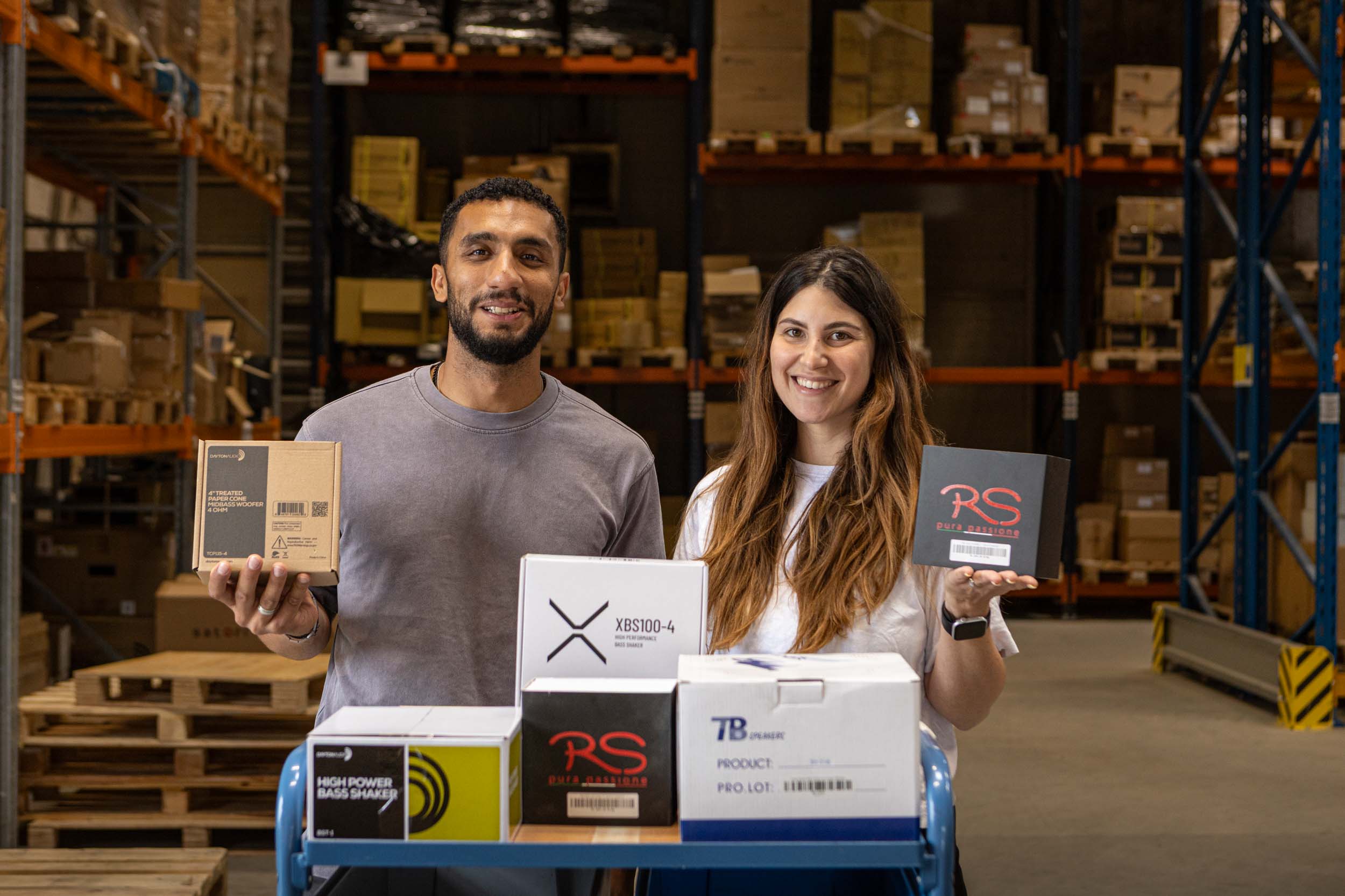 Audio Components team members with audio products in the warehouse